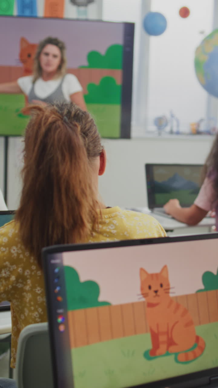 Teacher Educating Young Students During Digital Art Class Showing Creative Learning on Digital