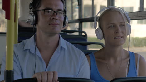 commuters enjoying music in the bus