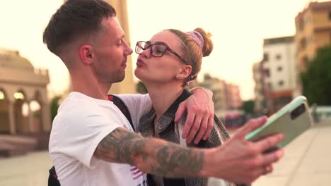 happy couple of tourists taking selfies outdoors