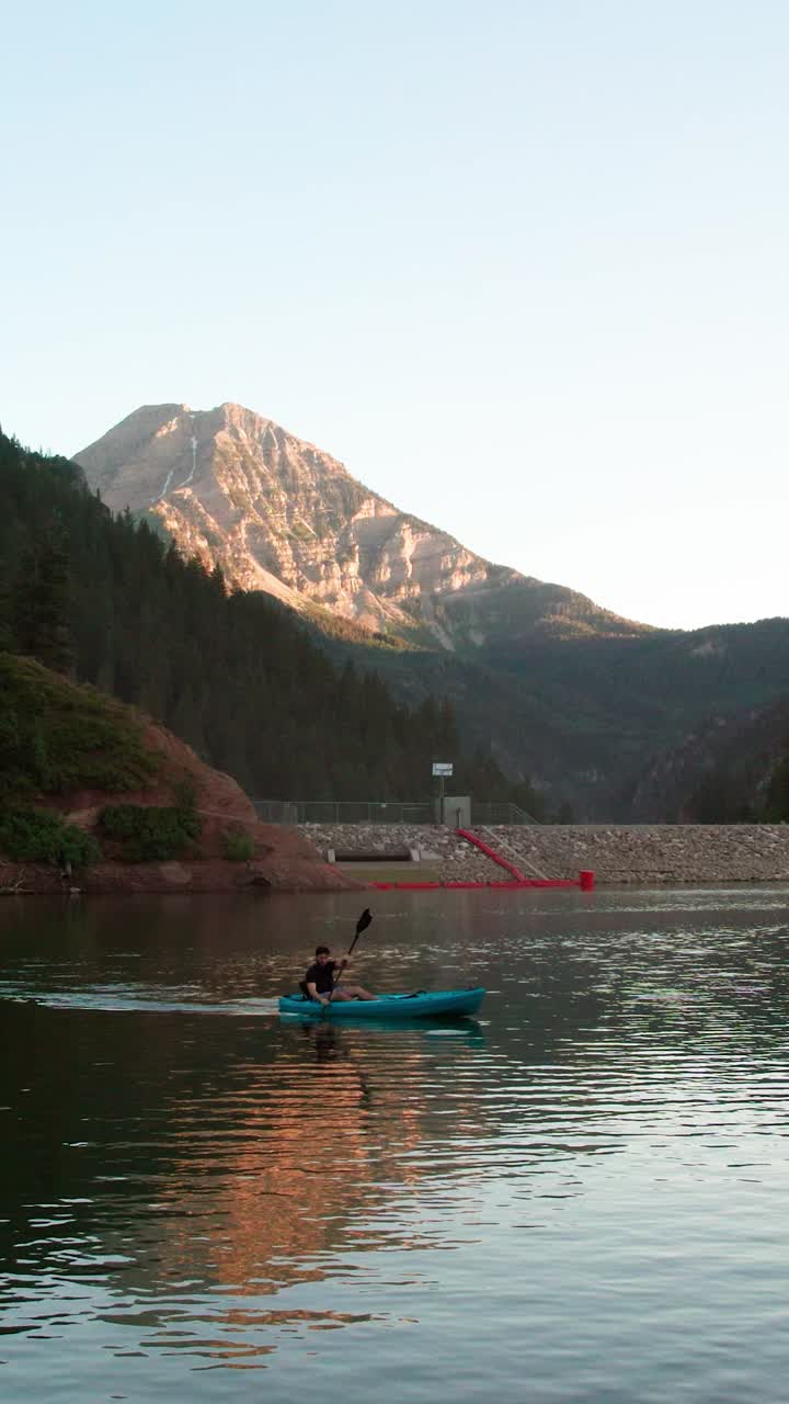 Vertical View Of A Kayaker At Tibble Fork Reservoir In American Fork Canyon, Utah, USA. Wide Shot