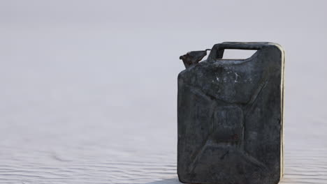 old rusted fuel can on the beach