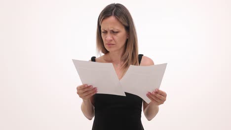 woman with a disgusted expression looking at documents