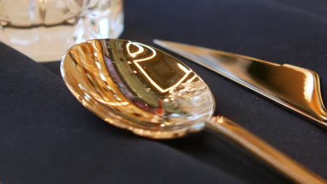 close-up of a silver spoon and knife