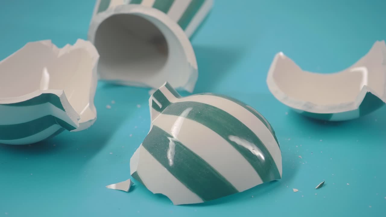Shattered White and Green Striped Ceramic Cup Pieces