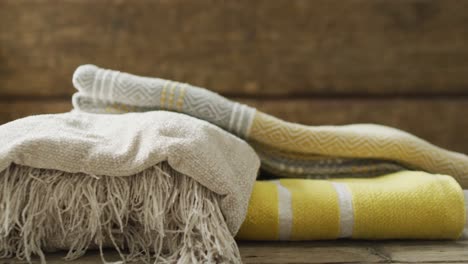 video of folded blankets lying on wooden background