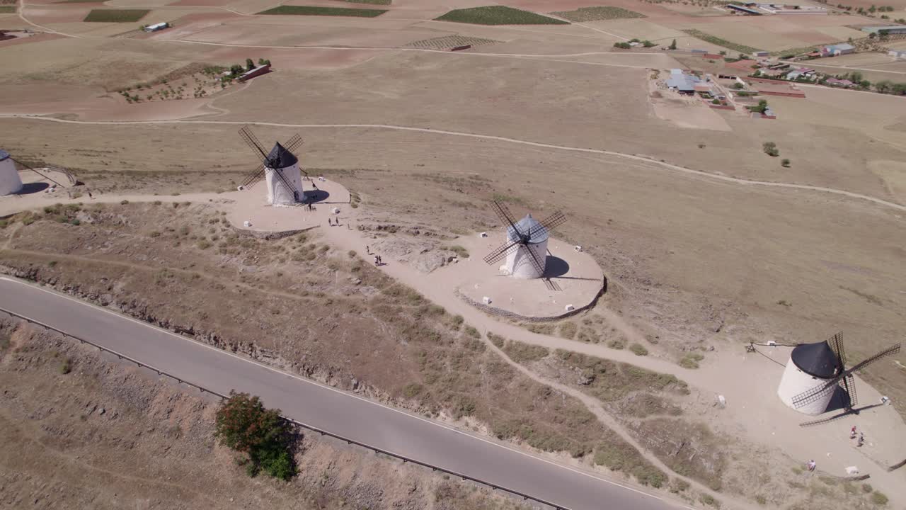 Spanish windmills on a mountaintop. Panoramic aerial view. Don Quixote. La Mancha, Consuegra. Spain