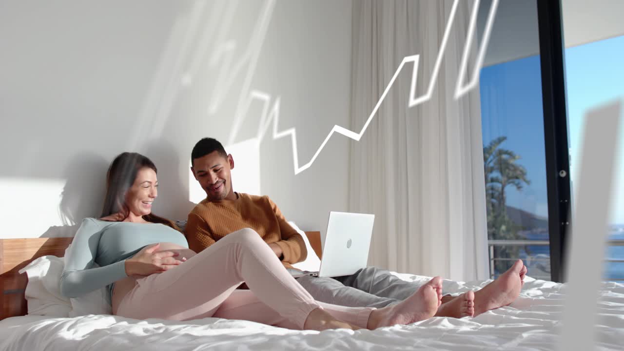 Couple on bed, man tapping laptop, causing white line, rising bars overlay, sharing pregnancy news