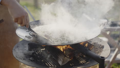 cooking onions over an open fire
