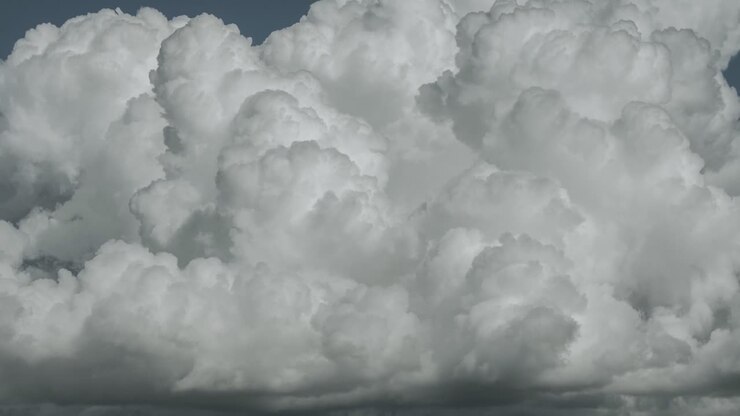 Time lapse footage of summer clouds growing and changing