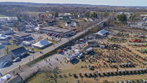 an aerial view of an amish mud sale in pennsylvania selling amish products on a sunny day