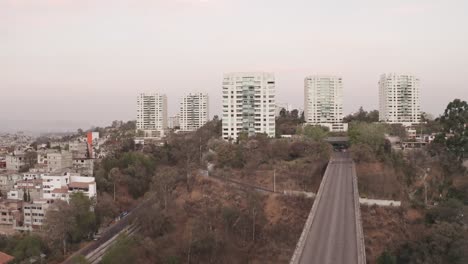 Aerial-establishing-shot-flying-over-la-enramada-town-at-day