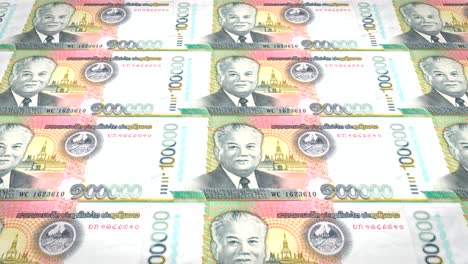 banknotes of one hundred thousand lao kip of laos rolling, cash money, loop