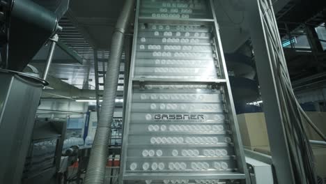 automatic filling machine pours water into plastic pet bottles at modern beverage plant