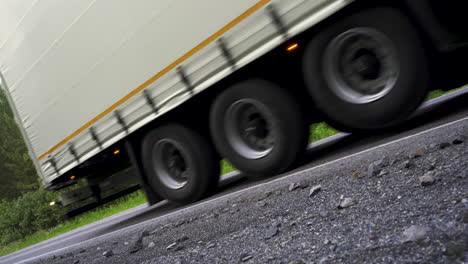 truck on a road through the forest