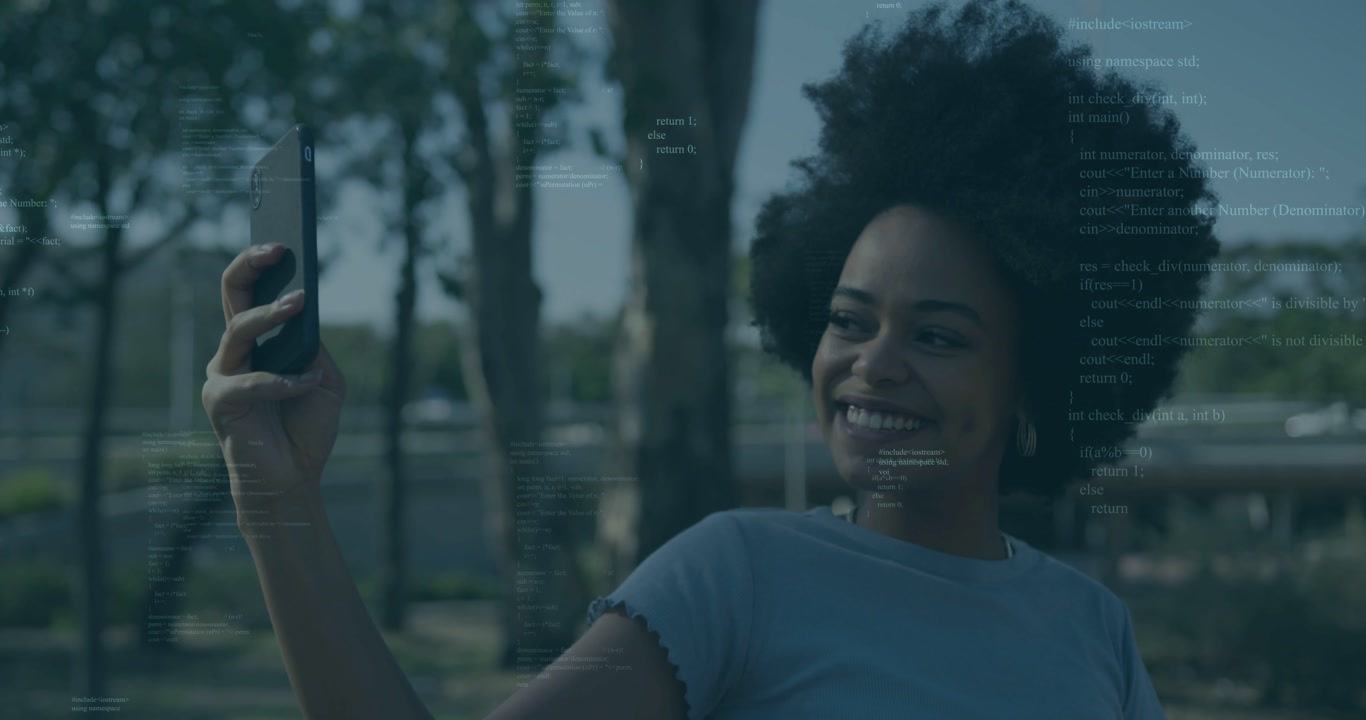Woman raising smartphone, framing selfie then scrolling tech texts in park, code overlay persisting