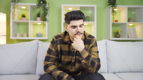 Stressed-young-man-looking-for-solution.