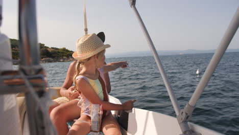 happy siblings sailing on a boat