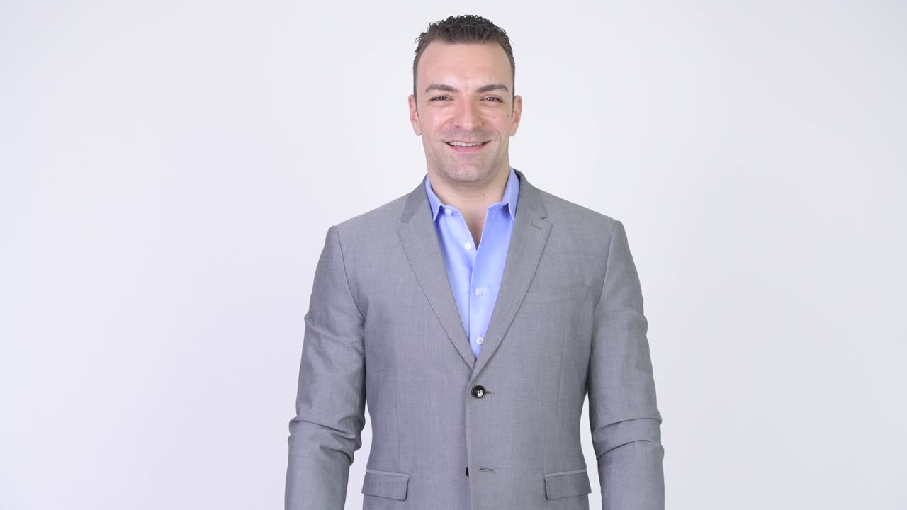 白い背景に隔離されたスーツを着たビジネスマンの肖像画