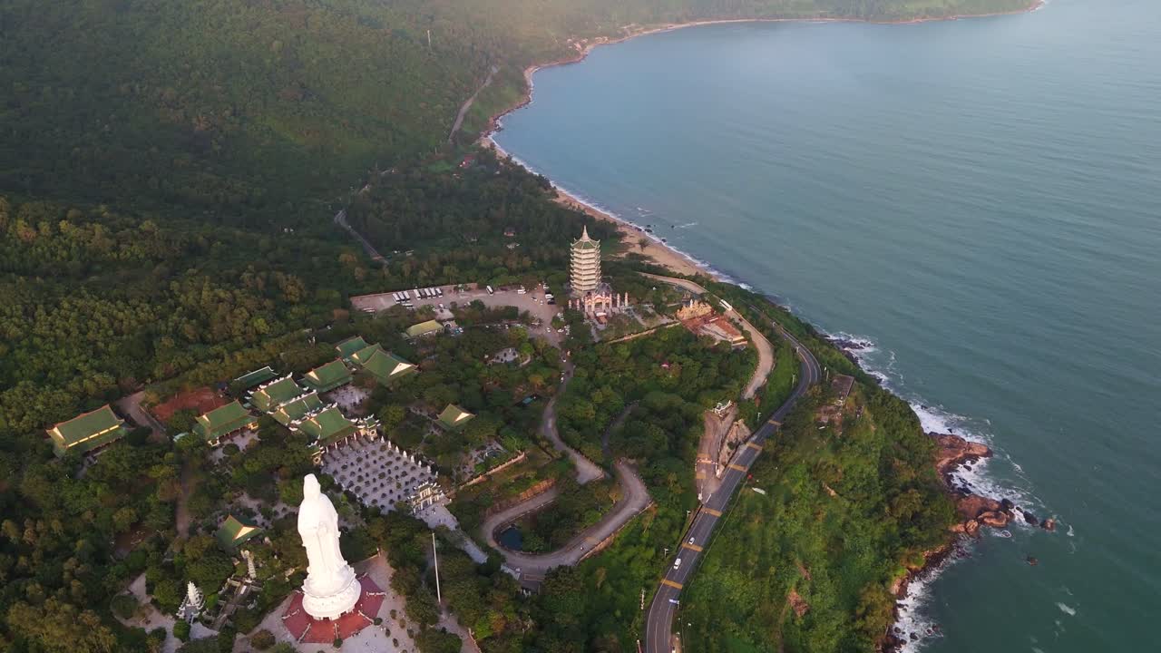 Bird's eye view of Linh Ung Pagoda complex and giant Lady Buddha statue. Majestic Buddhist architecture layout from above in Da Nang, Vietnam
