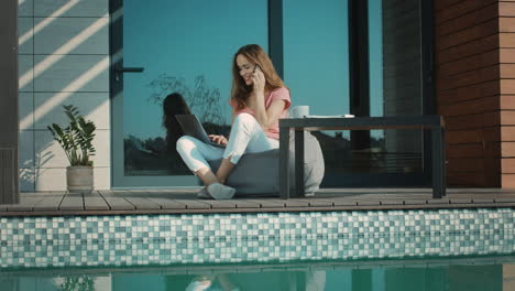 happy woman talking mobile outside house. business woman enjoy chatting.