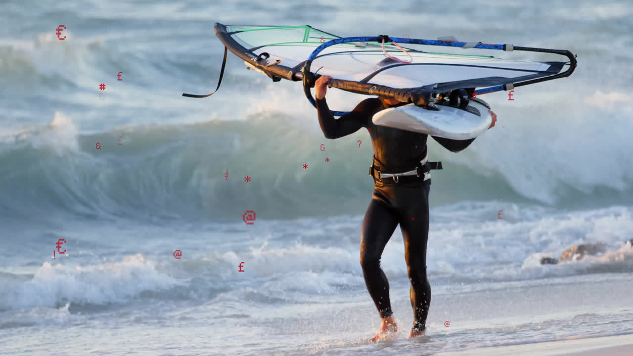 man carrying windsurfing rig walking shore showing floating speed gauge and chart for technology