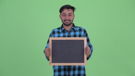 joven y guapo hombre persa hipster barbudo