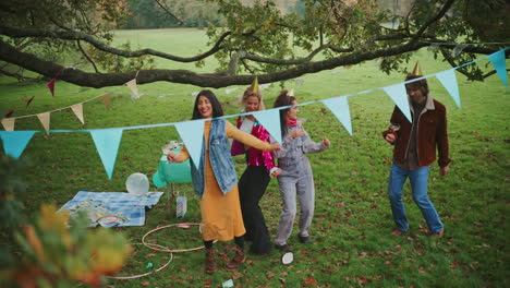 friends celebrating in a park