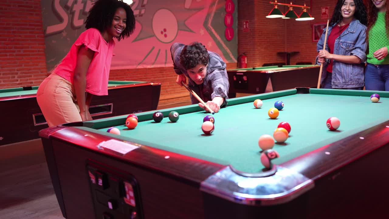 People playing pool indoors