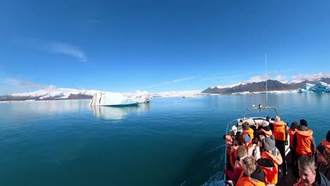 travelers are mesmerized by the serene beauty of iceland's picturesque winter landscape, with snow-capped mountains and clear blue skies as far as the eye can see.