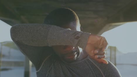 animation of blue trails over african american sportsman