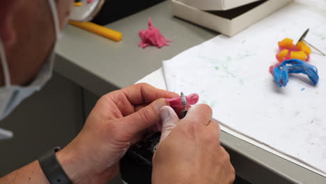 Dental-Technician-working-on-a-dental-Skeletal-prosthesis