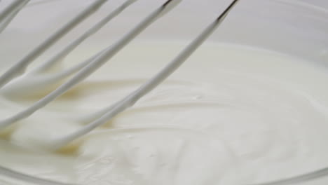 whipping cream being mixed