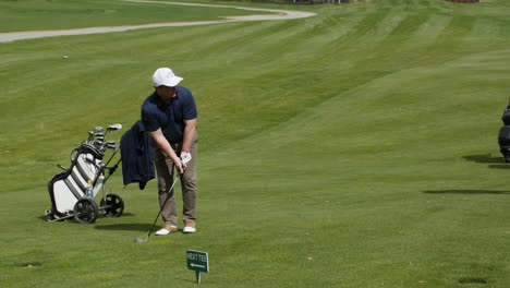 man playing golf on a sunny day