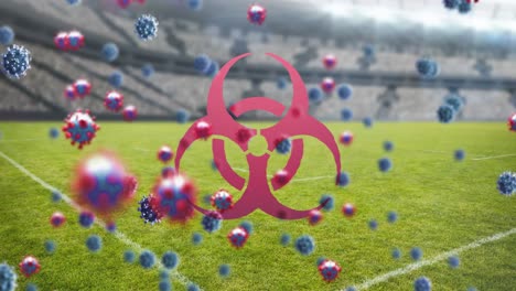 símbolo de riesgo biológico y células de covid-19 contra estadios deportivos vacíos