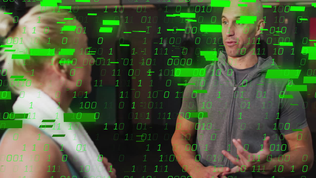 Binary code animation over two people discussing in modern office setting