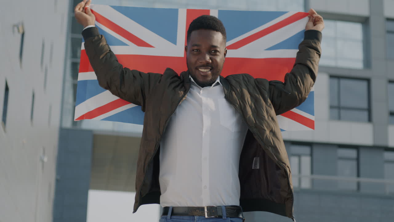 Man Holding British Flag