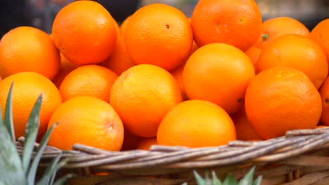 close-up of a basket of fresh oranges