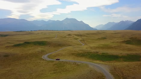 twisty road in ancient hilly glacial moraine in mountain foothills