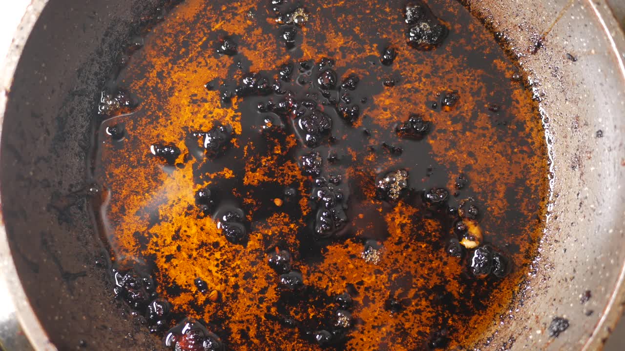 Burnt cooking oil in a pan