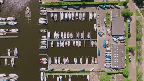 aerial top-down zoom in over residential neighborhood and canals in heeg, netherlands, in clear daylight