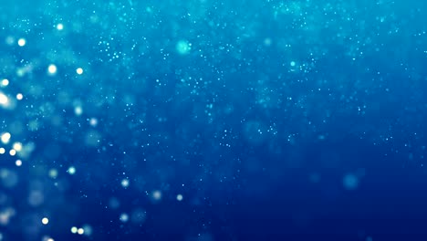 las partículas azules brillantes brillan y se desplazan a lo largo de una corriente suave. fondo de movimiento abstracto bucle sin costuras