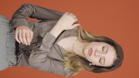 vertical video of young woman with shoulder pain.