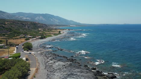 rocky seacoast along falassarna village in western crete, greece. aerial drone shot