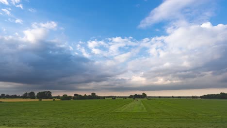 green fields, blue skies, and white clouds