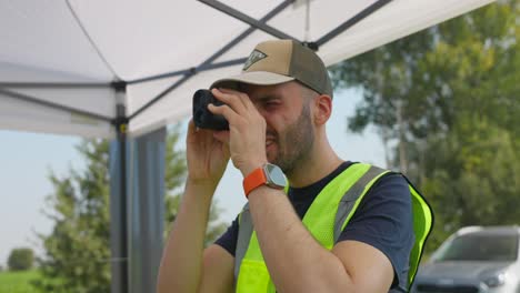 Drone-Teacher-Using-Spotting-Scope-At-Workshop