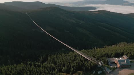 Aerial View of a Long Suspension Bridge in the Mountains