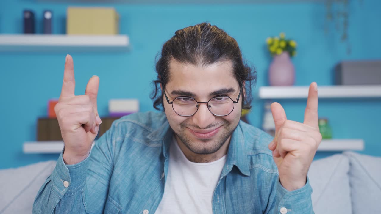 Fun young man thinking of a good idea.