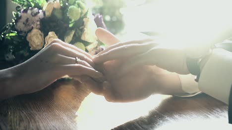 couple in a cafe holding each other&#039;s hands