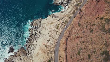 drone following a van driving a scenic coastal route in cape town south africa