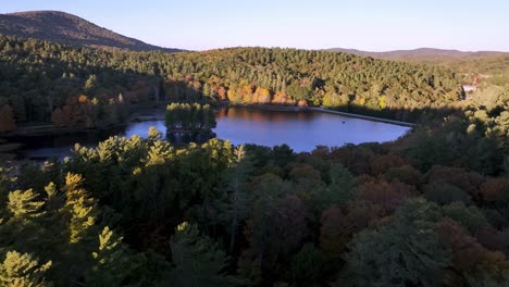 aerial push in to bass lake in blowing